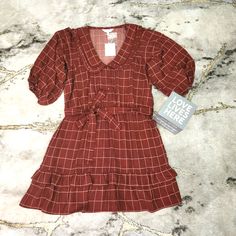 Women's Lauren Conrad Xxl Bohemian Brown/Pink Dress. Nwt Puff Sleeves/Elastic Waistline With A Tiefront Band /Buttons On The Front/Pink Lines Throughout/Ruffles At The Bottom Of The Dress?Polyester Simple Yet Perfect For A Dressier Summer Or Late Night Occasion. Style With Sandals Or Heels. Feminine Plaid Spring Dress, Pink Ruffle Hem Dress For Fall, Fall Pink Dresses With Ruffle Hem, Pink Ruffle Hem Mini Dress For Fall, Feminine Plaid Summer Dress, Pink Mini Dress With Ruffle Hem For Fall, Spring Plaid Bohemian Dresses, Spring Bohemian Plaid Dresses, Plaid Bohemian Dresses For Spring