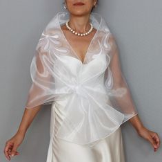 Add a touch of elegance to your wedding day with this exquisite snow-white organza bridal stole. Featuring delicate teardrop applique details, this see-through shawl is designed to gracefully drape over your shoulders, offering a light and airy feel. Perfect as a mesh wedding dress cover-up or topper, it adds a refined layer to any bridal ensemble while allowing your gown to shine through. Ideal for brides seeking a sophisticated, ethereal look that complements their style, this stole is a beaut Wedding Dress Cover Up, Mesh Wedding Dress, Wedding Dress Cover, Organza Bridal, Wedding Shawl, Dress Cover, Shawls And Wraps, Wedding Accessories, Snow White