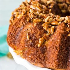 a bundt cake with pecans on top