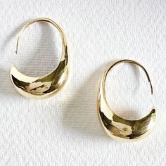 Handcrafted long drop orb hoops earrings handcast solid brass with wire backs. 1.5" long Part of the Molten brass collection. These are hand cast and show natural hanfcrafting irregularities which renders unique perfectly imperfect character to each piece. Arrives in logo drawstring protective pouch Gold Crescent Hoop Earrings With Hammered Detail, Gold Hammered Crescent Hoop Earrings, Hammered Brass Drop Earrings, Tarnish Resistant Brass Teardrop Earrings, Small Brass Hoop Earrings Tarnish Resistant, Small Hoop Brass Earrings Tarnish Resistant, Artisan Hammered Dangle Hoop Earrings, Hammered Bronze Teardrop Earrings, Bronze Hammered Teardrop Earrings