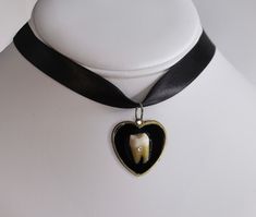 13" ribbon choker featuring an resin human  molar tooth embellished with Swarovski crystal on a gold tone or silver heart pendant. Adjustable 2" length. Chokers Aesthetic, Molar Tooth, Tooth Pendant, Ribbon Choker, Life Jewelry, Edgy Jewelry, Goth Clothing, Silver Heart Pendant, Resin Pendant