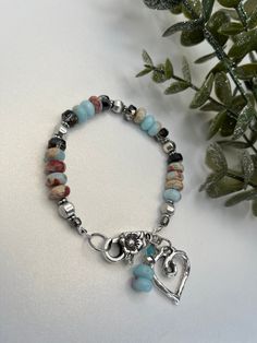 This bracelet  crafted by a natural gemstone snakeskin gemstone 💎  Design; boho. Spacers used sliver plated. Bohemian Amazonite Bracelets As Gift, Bohemian Silver Beaded Bracelets With Gemstones, Bohemian Silver Beaded Gemstone Bracelets, Handmade Bohemian Sterling Silver Beaded Bracelets, Hand-strung Bohemian Sterling Silver Beaded Bracelets, Southwestern Gemstone Beads Bracelet For Healing, Southwestern Gemstone Beads Healing Bracelet, Southwestern Style Healing Gemstone Beads Bracelet, Bohemian Silver Crystal Bracelet With Gemstone Beads