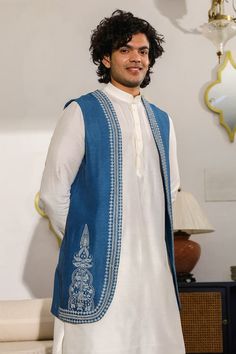 Cobalt blue longline bundi with resham and zari embroidery in mandala pattern. - Aza Fashions Traditional Blue Nehru Jacket With Traditional Drape, Traditional Blue Nehru Jacket For Eid, Traditional Blue Nehru Jacket, Blue Traditional Nehru Jacket, Blue Sleeveless Kurta For Festive Occasions, Traditional Sleeveless Cotton Outerwear, Festive Sleeveless Blue Kurta, Festive Blue Sleeveless Kurta, Unstitched Blue Nehru Jacket With Dabka