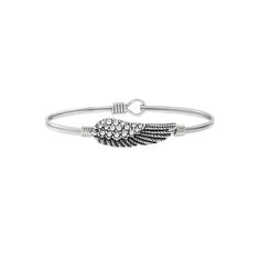 Luca + Danni's iconic, stacking bracelets are shaped to sit top of wrist so you can express the things that matter most to you. Celebrate your faith with this crystal angel wing bangle from Luca + Danni, featuring an oval design for a more comfortable fit. Luca + Danni's iconic, stacking bracelets are shaped to sit top of wrist so you can express the things that matter most to you. Celebrate your faith with this crystal angel wing bangle from Luca + Danni, featuring an oval design for a more com Silver Stackable Bracelets For Friendship, Silver Stackable Friendship Bracelets, Silver Stackable Jewelry For Friendship, Stackable Bangle Bracelets For Friendship, Metal Stretch Bracelet Stackable Gift, Stackable Friendship Bangle Bracelets, Casual Everyday Bangle Jewelry, Stackable Wrap Bracelet For Friendship, Casual Silver Stackable Bracelets