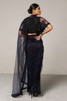 Navy blue saree with all-over delicate embellishments. Comes with embroidered blouse.
Component: 2
Embellished, Embroidered
Neckline: High Neck 
Sleeve Length: Half
Fabric: Net
Color: Blue
Thread work, crystal and crochet work
Flared sleeves - Aza Fashions Embellished Saree, Navy Blue Saree, Crochet Work, Net Saree, Blue Saree, Blouse For Women, Embroidered Neckline, Saree With Blouse, Thread Work