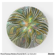 a circular glass plate with an abstract design on the front and side, in gold and green