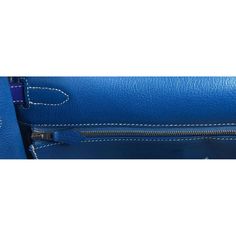 Description: Hermès Kelly 32 blue electric epsom leather handbag From the Candy Collection Palladium hardware Plastic on hardware Height: 9" Depth: 4" Length: 12.5" Reference number: LU1826214033852 (1stDibs) Seller Location is in Miramar, Florida Shipping Location is in Miami, Florida A return for this item may be initiated within 1 day of delivery Experienced sellers undergo a comprehensive evaluation by our team of in-house experts This item is priced in the lower range of recent sales of sim Designer Blue Shoulder Bag For Business, Designer Blue Satchel For Business, Luxury Blue Satchel With Silver-tone Hardware, Blue Business Shoulder Bag With Palladium Hardware, Blue Rectangular Satchel With Palladium Hardware, Blue Top Handle Satchel With Silver-tone Hardware, Blue Epsom Leather Rectangular Bag, Luxury Blue Epsom Leather Bag, Designer Blue Shoulder Bag With Leather Lining