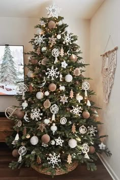 a decorated christmas tree in a living room