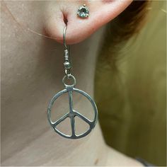 steerling silver peace sign earrings are handmade by Old Hippie Dave in Safety Harbor, Florida. Each one is hand fabricated out of 925 sterling silver and hand polished with 16 gauge silver. Because these earrings are handmade no 2 earrings are ever exactly the same. Symbolic Silver Jewelry With Peace Sign, Symbolic Silver Sterling Silver Plug Earrings, Silver Peace Sign Jewelry Gift, Nickel-free Sterling Silver Hippie Jewelry, Hippie Sterling Silver Nickel-free Jewelry, Handmade Symbolic Silver Plug Earrings, Hippie Style Sterling Silver Nickel-free Jewelry, Adjustable Sterling Silver Peace Sign Jewelry, Safety Harbor Florida