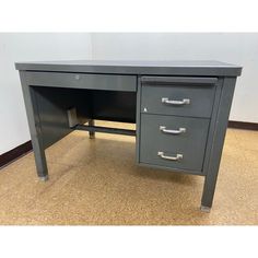 an office desk with two drawers on each side