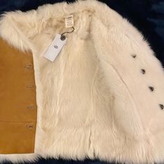 Authentic Ugg Renee Toscana Shearling Leather Jacket Vest Size: Xs Color: Chestnut Retail $995 New Without Tags Details: Luxe Toscana Twinface Looks Cooly Sophisticated In This Reversible Vest. Capture The Bohemian Mood Of The Season. Incredibly Soft. * Toscana Twinface * Front Button Closures * This Product Contains Real Fur From Sheep Or Lamb. Fur May Be Sourced From Australia, Ireland, The United Kingdom, Or The United States. * Made In Turkey. Brand New Without Tag, Never Worn. White Shearling Outerwear With Faux Fur Trim, White Shearling Outerwear For Fall, White Shearling Fur Coat, White Sheepskin Fur Coat For Fall, Winter White Sheepskin Fur Coat For Fall, White Sheepskin Outerwear With Faux Fur Trim, Cream Shearling Fur Coat For Fall, Ugg Jacket, Shearling Leather Jacket