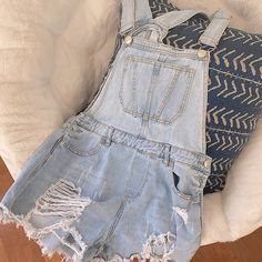 Size: 6 / Medium Color: Washed Denim Condition: Great / Never Worn Trendy Distressed Overall Bottoms, Dark Wash Distressed Overalls, Cotton Ripped Jean Overalls, Cotton Ripped Overall Jeans, Ripped Cotton Denim Overalls, Ripped Cotton Overall Jeans, Cotton Ripped Jeans Overall, Light Wash Cotton Denim Jumpsuit With Frayed Hem, Denim Overalls With Frayed Hem