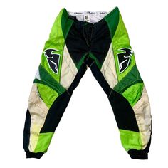 a pair of green and white pants with black trims on the bottom, front and back