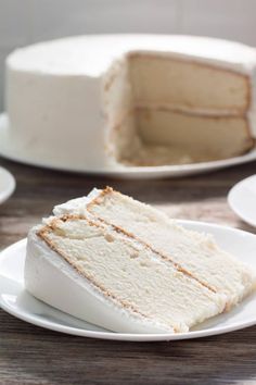 a slice of cake sitting on top of a white plate next to another piece of cake