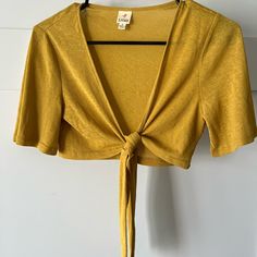 Ijoah Cropped Front Tie Shirt Size Small New Without Tags Mustard Yellow Never Worn Cropped Cotton Tops For Brunch, Casual Fall Crop Top For Vacation, Cropped Tops For Fall Vacation, Casual Cropped Tops For Brunch, Yellow Casual Crop Top For Brunch, Casual Yellow Tops For Brunch, Yellow Tie Front Cardigan, Yellow Cropped Cotton Top, Spring Beach Crop Top T-shirt