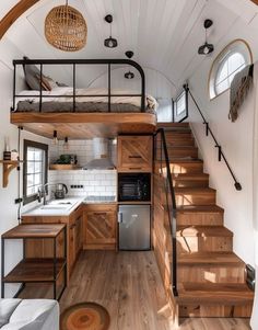 the interior of a tiny house with stairs