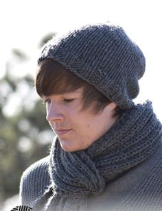 a man wearing a knitted hat and scarf