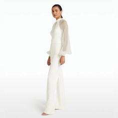 Safiyaa Danna Ivory Jumpsuit Regular Price 1,095 Crew Neck, Loop-Hole, Long Sleeve Jumpsuit With Wide Leg In Ivory. Fits True To Size. Model Is 175cm | 5'9'' And Wearing A Fr36 Heavy Crepe: 92 % Polyester 8 % Elastane Soft Organza: 100% Silk Dry Clean Only Size 8 Available Brand New, Never Worn. For More Information, Dm. Shop Now! Chic Long Sleeve Jumpsuits And Rompers For Wedding, White Long Sleeve Pantsuit For Party, Chic Long Sleeve Jumpsuit For Wedding, Elegant White Long Sleeve Jumpsuit, White Long Sleeve Jumpsuits And Rompers For Evening, White Long Sleeve Jumpsuits For Evening, White Long Sleeve Evening Pantsuit, Elegant Cream Jumpsuits And Rompers For Party, Elegant Cream Jumpsuit For Party