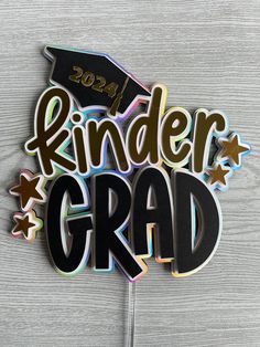 the word kinder grad is made out of cutout paper and surrounded by stars