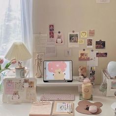 a desk with various items on it including a computer