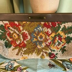 "This vintage clutch purse dates from the 1950s or 60s. No labels or tags. This is a needlepoint fabric bag with vinyl top. Closes with metal zipper. Inside has single compartment. The purse measures 10.5\" wide by 4.5\" high. It measures 2\" across the bottom of the bag. Lined with black fabric. Condition is good. Shows minimal wear & soil. Zipper starts a little hard but is not broken or stuck. Sweet vintage bag!" Vintage Embroidered Rectangular Clutch, Vintage Multicolor Bags With Zipper Pouch, Vintage Travel Clutch Pouch, Vintage Rectangular Travel Clutch, Vintage Rectangular Clutch With Zipper, Vintage Rectangular Zipper Pouch Bag, Vintage Multicolor Pouch Clutch, Vintage Rectangular Zippered Bag, Vintage Clutch Purse