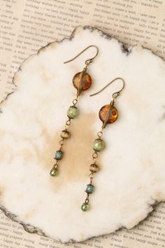 The Rustic Creek Collection is a crowd favorite. Featuring designs that are a must-have for every season and pairs well with any outfit. Antique Brass (Lead & Nickel Free) Czech Glass 3" with antique brass ear wires We hand select our natural materials, thus there may be slight variations in color and/or size that will not detract from the overall aesthetic. Our unique handcrafted designer jewelry for women is made in America, each design created individually in our personal design studio in Flo Vintage Beads Jewelry, Elegant Cheap Czech Glass Earrings, Czech Beads Jewelry Bracelets, Vintage Beaded Jewelry, Czech Glass Earrings, Unique Jewelry Inspiration, Handmade Earrings Ideas, Czech Beads Jewelry, Unique Beaded Jewelry