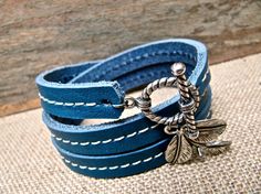 neat Handmade Leather Wrap Bracelet Gift, Handmade Leather Wrap Bracelet For Gift, Leather Hand Wrapped Bracelet For Gift, Handmade Leather Friendship Bracelets, Adjustable Blue Leather Strap Jewelry, Adjustable Blue Jewelry With Leather Strap, Adjustable Blue Leather Bracelets, Blue Leather Bracelet For Gifts, Blue Leather Bracelet As Gift