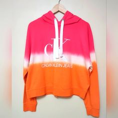 Calvin Klein Jeans Women's Tie Dye Hoodie Size Large Pink/Orange/White Ck Jeans Logo Silver Tone Hardware Nwot Pit To Pit 27" Length 22" Spring Color Block Athleisure Sweatshirt, Spring Athleisure Color Block Sweatshirt, Pink Relaxed Fit Sportswear Sweatshirt, Pink Sportswear Hoodie For Spring, Pink Crew Neck Hoodie For Sportswear, Trendy Pink Color Block Sweatshirt, Sporty Spring Hoodie With Color Block, Pink Color Block Sweatshirt For Spring, Sporty Color Block Hoodie For Spring