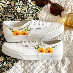 Fresh all white Vans Authentic trainers delicately hand embroidered with bold, bright sunflowers, rich green foliage and finished with a name, date, initials or words of your choice. Each pair is hand made to order and stitched with high quality embroidery thread which is washable and fade resistant.  If you're looking for something a little more bespoke, I offer a limited number of fully custom hand embroidered trainers tailored to your wishes. Consider your wedding theme, your favourite flowers, your bouquet and more all tailored to your budget. We can work together to create something perfect for you. Check out my Etsy store for the 'custom order' listing, please read item description before purchase. I'm on Instagram! Follow me @OliveString for extra design inspiration and sneak peeks White Vans Authentic, All White Vans, Embroidered Vans, Wedding Vans, Sunflower Vans, Embroidery Shoes, Embroidered Shoes, White Vans, Stunning Shoes