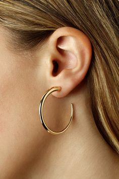 14k Modern Hoop Earrings Made with 14k Yellow Gold Size: Small Modern Twist Hoop Jewelry For Everyday, Contemporary Hoop Jewelry For Formal Occasions, Sleek 14k Gold Jewelry, Modern Pierced Hoop Earrings For Everyday Luxury, Contemporary Small Hoop Earrings With Polished Finish, Modern Twist Hoop Earrings With Polished Finish, Modern Single Earring With Open Circle Design, Modern Hoop Earrings For Everyday Luxury, Modern 14k Gold Circle Earrings