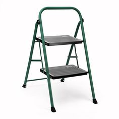 a green step stool with two steps on it