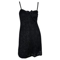 Presenting a black lace Yves Saint Laurent Rive Gauche mini dress. From the early 1990s, this beautiful dress is covered in lace and features a sweetheart-style neckline with spaghetti straps and a plunging lace-up detail at the front. Effortlessly chic and timeless, this little black dress is the perfect addition to any wardrobe! Approximate measurements: Size - IT40 34.5" total length 34" bust 31" waist 39" hips Yves Saint Laurent Dress, Ruffled Silk Dress, Saint Laurent Clothes, Saint Laurent Dress, Safari Dress, Witch Dress, Cocktail Dress Vintage, Y2k Outfits, Rive Gauche