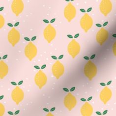 a pink background with yellow and green lemons