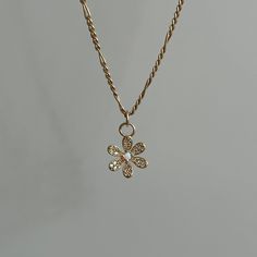 Made with genuine 14k USA gold-filled, this necklace is durable, hypoallergenic, and designed for everyday wear without tarnishing. Gold-filled jewelry is an excellent choice for anyone who love the look and durability of solid gold but want a more affordable option.  Details - Chain: 14k Gold-filled 1.9mm Figaro Chain  - Length: 16, 18, 20 inches  - Charm: Gold rhodium plating over brass with cubic zirconia, lab created opal - Hypoallergenic, water resistant, non-tarnish chain Why Choose Gold-Filled Jewelry? - Quality: The term '14/20' indicates that 5% of the total weight is 14k gold - Affordable: Gold-filled jewelry is a cost-effective way to indulge in fine jewelry. - Durable: With proper care, gold-filled jewelry will maintain its beauty for years.  - Hypoallergenic: Perfect for sensi Delicate Hypoallergenic 14k Gold Necklace, Gold Flower Necklace In 14k Gold, Everyday Flower Charm Jewelry, Gold Hypoallergenic Necklace With Flower Pendant, Everyday Jewelry With Flower Charm Pendant, Gold Hypoallergenic Flower Pendant Necklace, Everyday Jewelry Pendant With Flower Charm, Hypoallergenic Gold Necklace With Flower Pendant, Everyday Flower Charm Pendant Jewelry