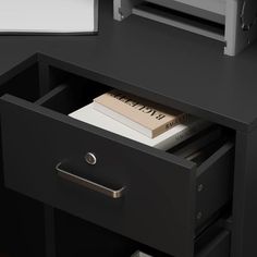 a black desk with two drawers and a printer on the top one drawer is open