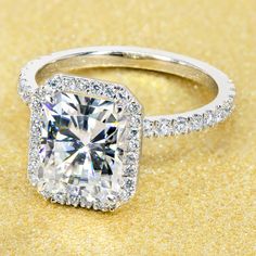 14K Gold Classic 2.7ct Radiant-cut Halo Moissanite and Diamond Engagement Ring | Earthena Jewelry Classic Halo Engagement Ring, Ring Cuts, Classic Romance, Future Engagement Rings, Basket Setting, Ring Settings, Diamond Halo Engagement Ring, Radiant Cut Diamond, Classic Engagement Rings