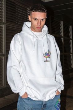 a man in a white hoodie standing in a hallway Casual Hooded Hoodie With Screen Print, Casual Hooded Sweatshirt With Screen Print, Casual Hoodie With Back Print, Casual Hoodie With Back Print For Fall, Casual Hooded Sweatshirt With Back Print, White Casual Sweatshirt With Back Print, Casual Fall Hoodie With Back Print, Casual Winter Hoodie With Back Print, Casual Hooded Top With Back Print