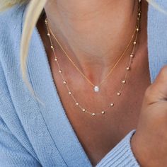 Ever wish you could have a tennis necklace but all gold and no diamonds? Us, too. Gold lovers will delight in the Poppy Rae Eternity Pebble Station Necklace. Made entirely of 14 karat gold pebbles, this station necklace is what is missing from your collection. The comfortable weight of the 14k gold orbs makes this an easy go-to, everyday piece. This timeless style will pair beautifully with the rest of your Dana Rebecca Designs collection. We love to layer it with the Lulu Jack Vertical Bar and Anniversary Yellow Gold Necklace With Satellite Chain, Anniversary Yellow Gold Satellite Chain Necklace, 14k Gold Satellite Chain Necklace For Anniversary, Gold Tennis Necklace With Delicate Chain As Gift, Anniversary 14k Gold Station Necklace With Diamond Accents, Gold Single Strand Teardrop Necklace, Dainty Gold Tennis Necklace For Gift, Gold Teardrop Single Strand Necklace, Gold Diamond Necklace With Satellite Chain As A Gift