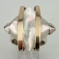 Not big on gold but i like the setting. Stunning Handcrafted 9K Gold Silver Mother of Pearl Ring by jewela, $98.00 Mother Of Pearl Ring, Silver Pearl Ring, Ring Pearl, Gold Pearl Ring, Pearl Jewelry Wedding, Gold Decor, Jewelry Wedding, Gold Pearl, Silver Pearls