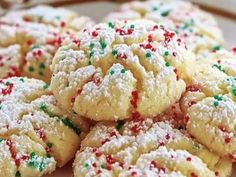 cookies with sprinkles are on a plate