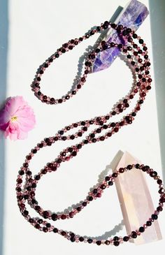 "Vitality Garnet Tantric Necklace" – Elevate Your Energy and Spiritual Practice Step into a realm of heightened vitality and spiritual empowerment with our "Vitality Garnet Tantric Necklace," a divine fusion of elegance and potency. Each necklace is meticulously crafted with 416 gemstones intricately joined in a pattern representing the sacred 8 Fold Path of Yoga, making it a profound yogic tool to enhance your magnetic field and elevate your spiritual journey. Key Features: 📿 Intricate Design: Spiritual Adjustable Faceted Necklace, Adjustable Spiritual Garnet Jewelry, Spiritual Garnet Gemstone Necklace, Spiritual Amethyst Necklace With Faceted Beads, Faceted Garnet Red Necklace, Mala Meditation, Rituals Set, Oil Shop, 108 Bead