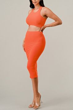 Our Cropped Curved Hem Tank Top Skirt Set is the perfect pick for fashion-savvy fashionistas. This two-piece set includes a cropped top with a curved hemline and a skirt with an A-line silhouette. Crafted from a lightweight, breathable blend of fabrics, this set ensures they stay cool and comfortable all day long. Fabric & fit: Model is wearing size Small. Trendy Fitted Cropped Skirt, Trendy Cropped Fitted Skirt, Chic Two-piece High Waist Crop Top, Fitted Two-piece Crop Top For Summer, Fitted Two-piece Skirt Set For Spring, Solid Color Crop Top For Spring Night Out, Trendy Two-piece Skirt For Spring, High Waist Two-piece Skirt For Spring, Trendy Fitted Two-piece Crop Top Set