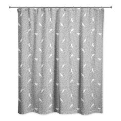 a gray shower curtain with white birds on it