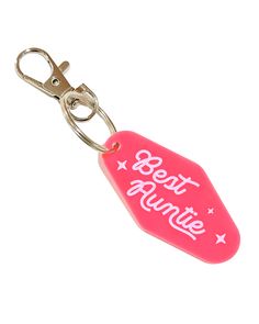 a pink keychain with the words best minute on it