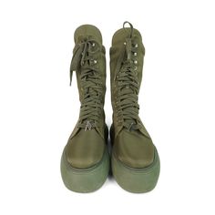 Attico 'Selene' combat boots in green nylon with a lace up closure with green laces, silver grommet and charm hardware, and a green platform sole. Brand = Attico Size = 37EU Condition = 8/10, Very good. Light scratches in nylon toe, some wear to soles. Material = Nylon Hardware = Silver Platform Height = 2" SKU = 19963-32 Green High-top Lace-up Outdoor Boots, Green Outdoor Boots With Lug Sole, Green Boots With Rubber Sole For Spring, Green High-top Combat Boots For Outdoor, Green Leather Boots For Streetwear, Green Lace-up Combat Boots For Outdoor, Green Leather Combat Boots For Outdoor, Green High-top Boots With Rubber Sole, Trendy Green Boots With Lug Sole