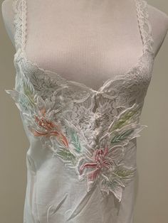 This absolutely stunning sheer cotton lawn nightgown by Natori is simply captivating! Vintage sheer cotton with a beautiful embroidered floral decal at the bodice. Pearl non functional buttons and non adjustable lace straps! Please use measurements as this is a vintage garment.  Very slightly faded or aging/yellowing to the fabric. Decal on front May need to be attached more securely at the various points. No real issues! Bust flat is 16 inches No stretch. Double for all around 9 inch strap drop Sheer Nightgown, Floral Decal, Women's Nightgowns, Lace Straps, Nightgowns, Vintage Cotton, Embroidered Flowers, Night Gown, Lace