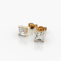 18K Yellow Gold Asscher Cut Shape Diamond Stud Earrings (Mounting). This pair of classic, asscher shape diamond earrings feature a tapered basket that showcases the unique characteristics of the asscher shape diamonds of your choice. The bold flashes of light and a luminescent nature capture the eye with every move. Luxury Yellow Gold Diamond Ring With Asscher Cut, Luxury Emerald Cut Diamond Earrings For Formal Occasions, Luxury Emerald-cut Diamond Earrings For Formal Occasions, Elegant Octagon Earrings For Formal Occasions, Formal Earrings With Baguette Cut Single Diamonds, Formal Earrings With Baguette Cut Diamonds, Classic Formal Baguette Cut Diamond Earrings, Classic Diamond Baguette Cut Earrings, Classic Diamond Earrings With Baguette Cut Single Diamonds