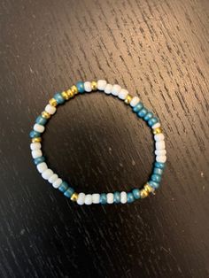 this bracelet is made out of seed beads and is white and blue and gold colors! it's so pretty!! Wedding Bracelets, Seed Bead Bracelet, Gold Colors, Wedding Jewelry Bracelets, Seed Bead Bracelets, Blue And Gold, Wedding Bracelet, Clay Beads, Bead Bracelet