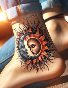 a woman's foot with a sun and moon tattoo on it