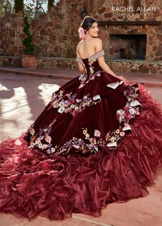 Look unforgettable in this embroidered floral applique long off shoulder velvet dress with A-line ruffled skirt by Rachel Allan RQ3111. Charro style quinceanera ball gown features beaded off-the-shoulder neck line, multi-color floral applique on velvet bodice and skirt overlays, organza ruffle skirt, cathedral train, and lace-up back closure. Off Shoulder Ruffled Quinceanera Dress by Rachel Allan RQ3111 Rachel Allan Charro Collection: Fall 2023 Style Number: RQ3111 Fabric: Velvet, Organza, Appli 1500 Dresses, Vestido Charro, Charro Quinceanera, Aunt Jemima, Peplum Designs, Military Ball Dresses, Cathedral Train, Champagne Dress, Dresses Quinceanera